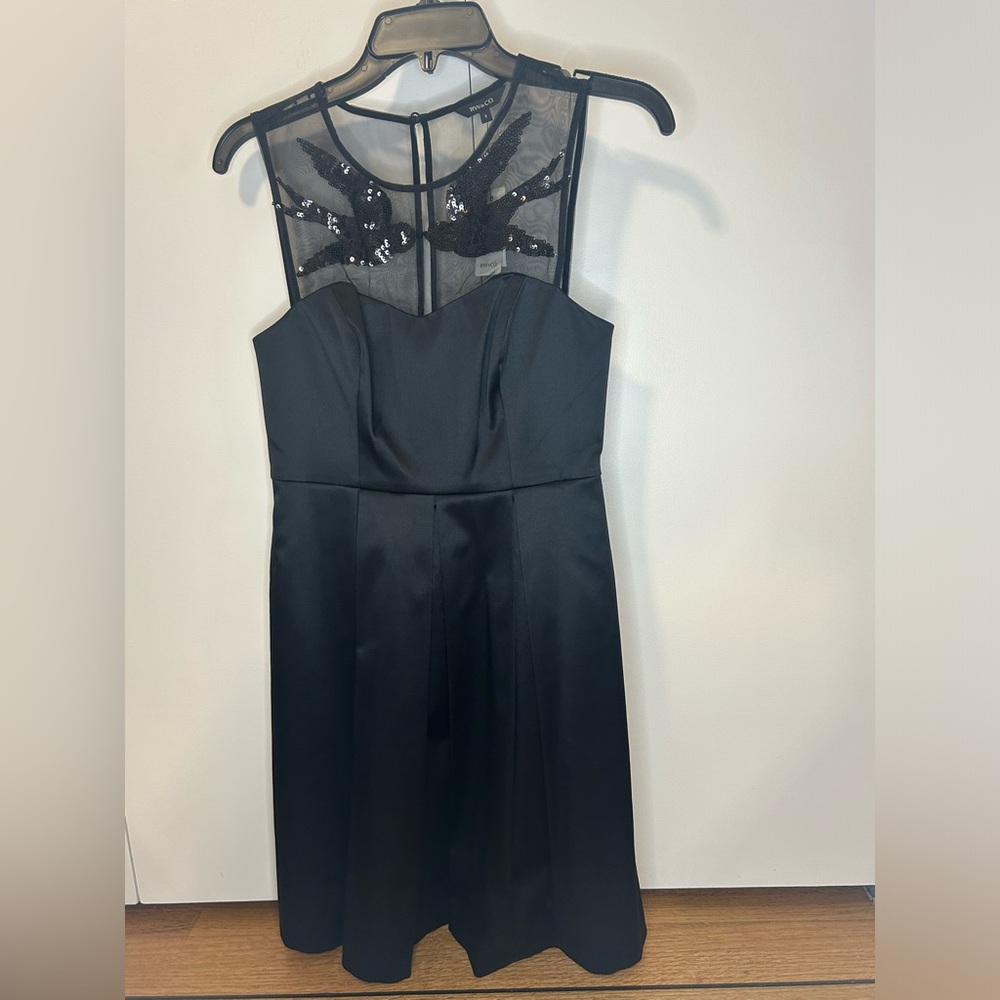 RW & CO Black dress with mesh top and sparkling bird size 2